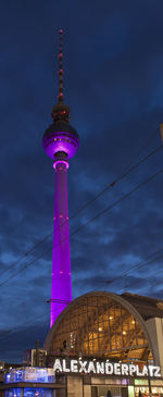 Low angle view of communications tower against sky