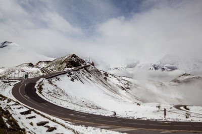 Scenic view of snow covered mountains against sky