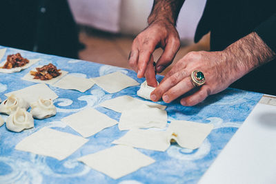 Mid section of a man preparing snacks