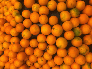 Full frame shot of oranges at market stall