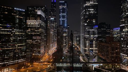 High angle view of illuminated buildings in city at night