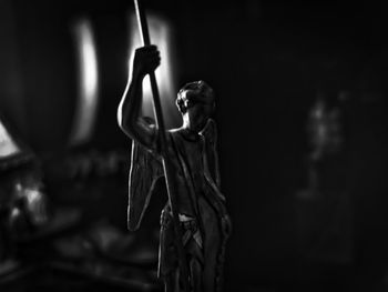 Close-up of statue in darkroom