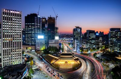 High angle view of illuminated city at dusk