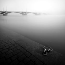 Bridge over river against sky