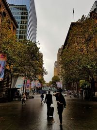 People walking on city street