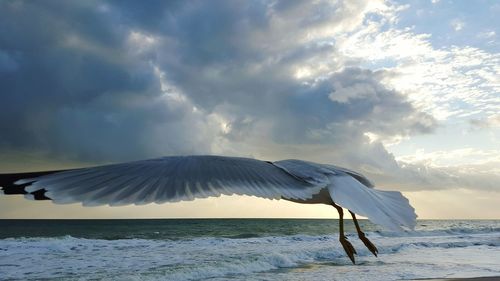Sea against cloudy sky