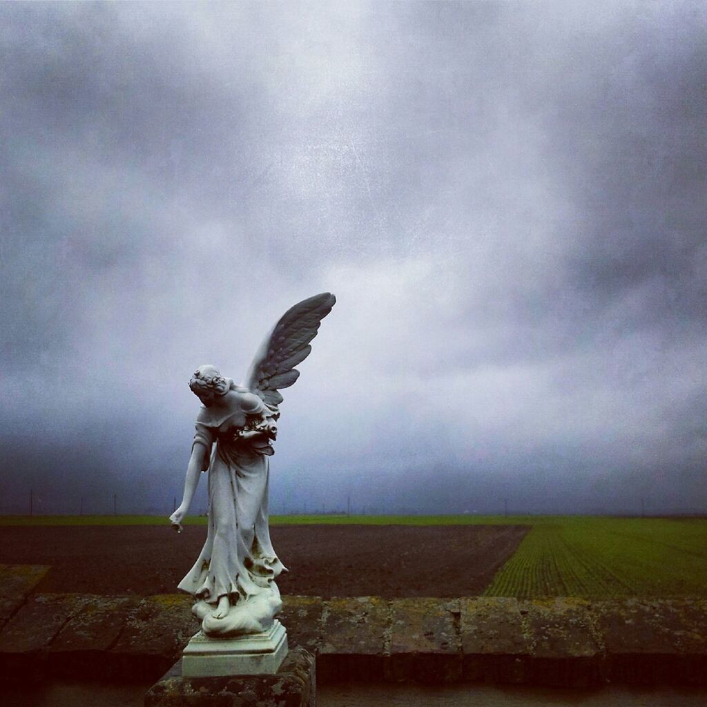 statue, sky, sculpture, art and craft, cloud - sky, bird, cloudy, human representation, art, overcast, creativity, cloud, animal themes, day, no people, animals in the wild, weather, one animal, outdoors