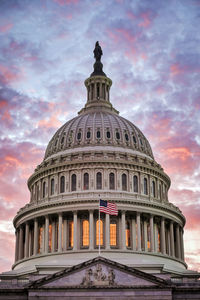 Low angle view of historical building against cloudy sky