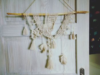 Close-up of clothes hanging on rope at home