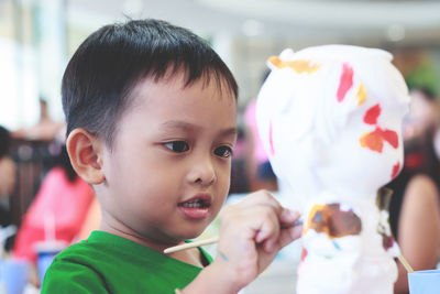 Close-up of boy painting