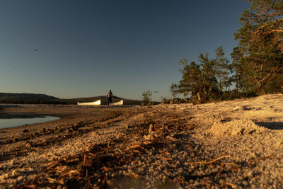 Scenic view of field against clear blue sky