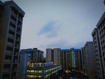 Low angle view of buildings against sky in city