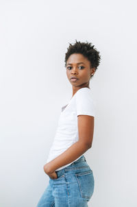 Portrait of charming beautiful young african american woman in white t-shirt isolated on white 