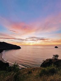 Stunning sunset on a hilltop at anawangin cove, zambales, philippines