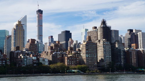 View of modern buildings in city against sky