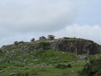 Scenic view of cliff against sky