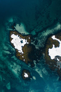 Aerial view of rusty and sea