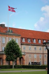 Flag on building against sky