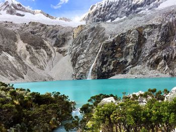 Scenic view of lake with mountains in background