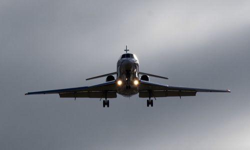 Low angle view of airplane flying in sky