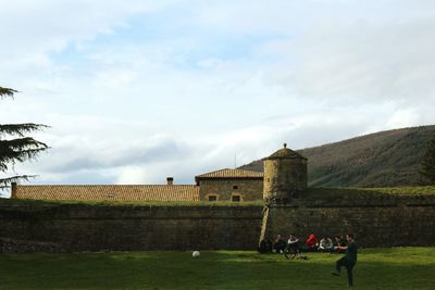 Built structure against cloudy sky