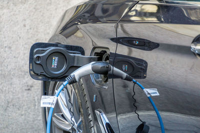 Close-up of electric car charging