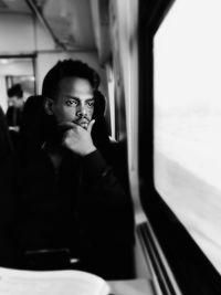 Young woman sitting in train