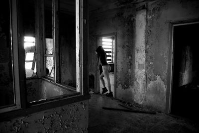 Man standing in abandoned building