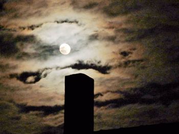 Low angle view of cloudy sky at dusk
