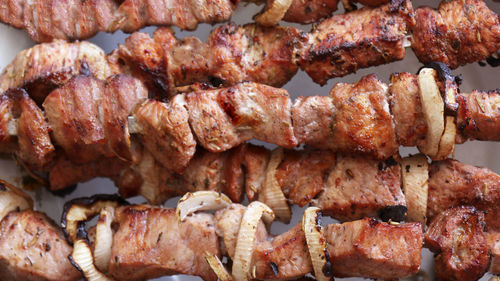 Kebabs on skewers prepared on charcoal grill, grilled meat, grilled food, shashlik