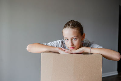 Cute boy with cardboard box