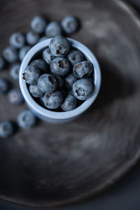 High angle view of black fruits in bowl