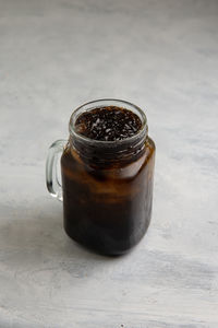 Close-up of drink in jar on table