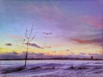 Scenic view of sea against sky at sunset