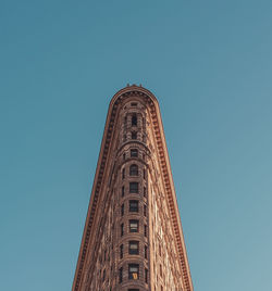 Low angle view of building against clear blue sky