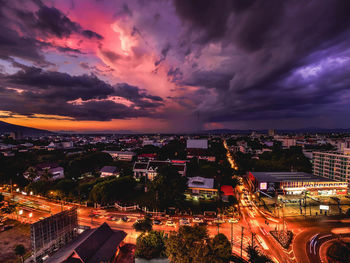 High angle view of illuminated buildings against sky during sunset