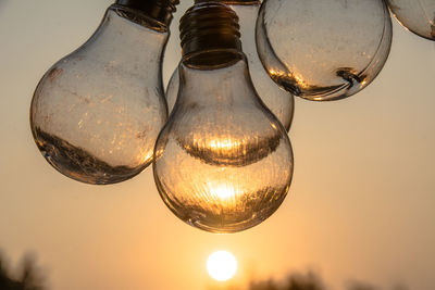 Low angle view of illuminated light bulb