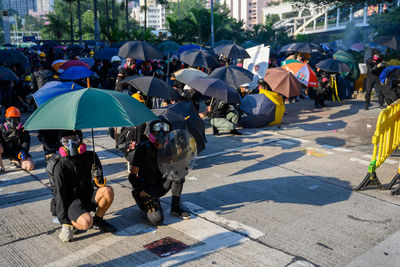 Protesters protesting on road in city