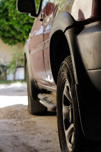 Close-up of old car on road