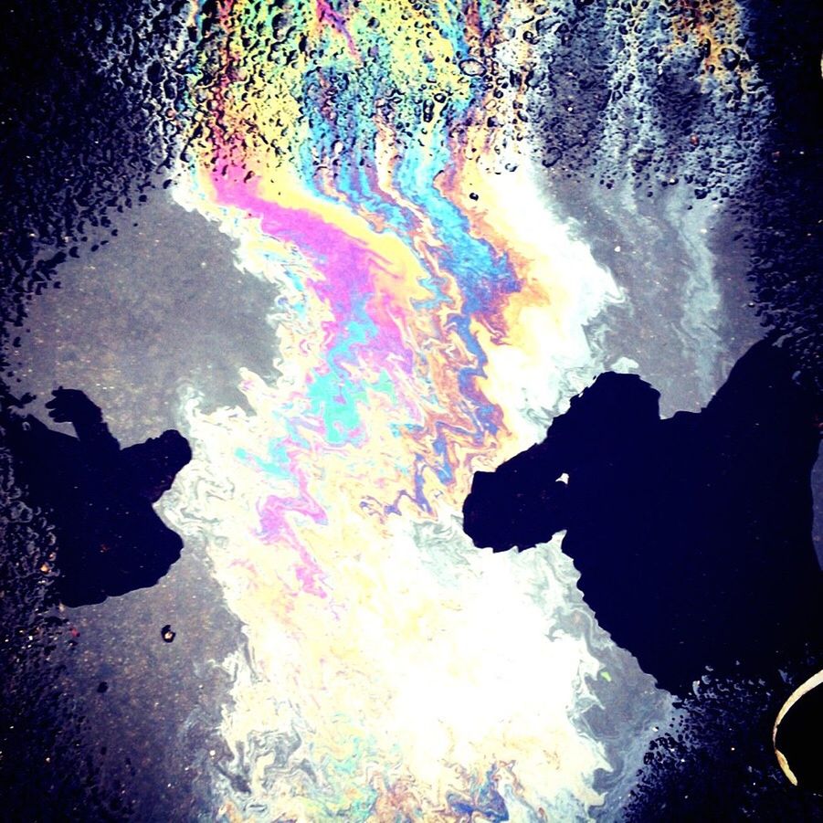 oil spill, oil, multi colored, silhouette, outdoors, real people, men, day, water, people