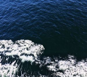 High angle view of rocks in sea