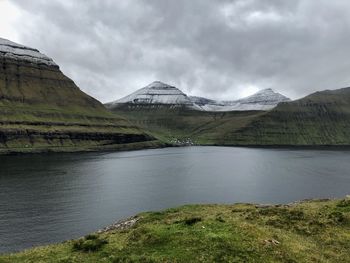 Scenic view of lake and mountains against sky