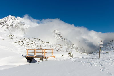 Scenic view of snow covered mountain against sky