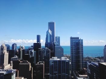 View of skyscrapers against blue sky