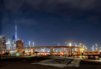 Illuminated city buildings at night