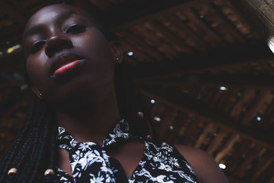 Portrait of young woman looking up