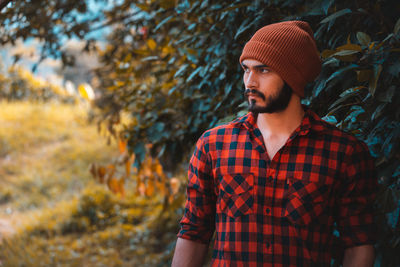 Portrait of young man standing outdoors