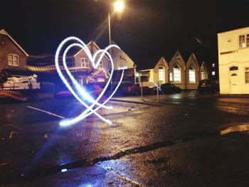 Illuminated street at night