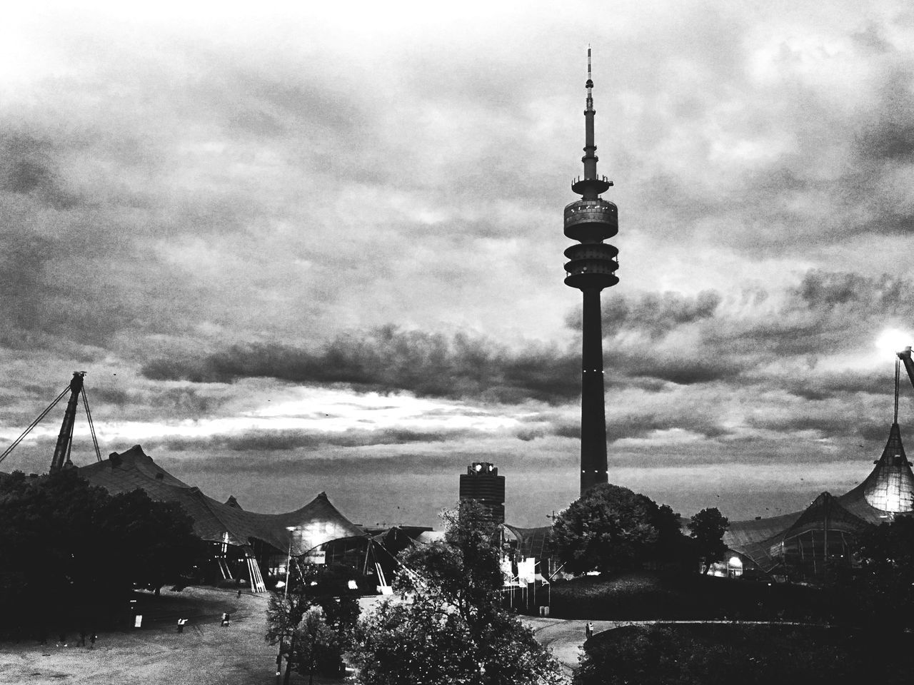 COMMUNICATIONS TOWER AGAINST CLOUDY SKY