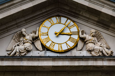 Low angle view of clock tower in building